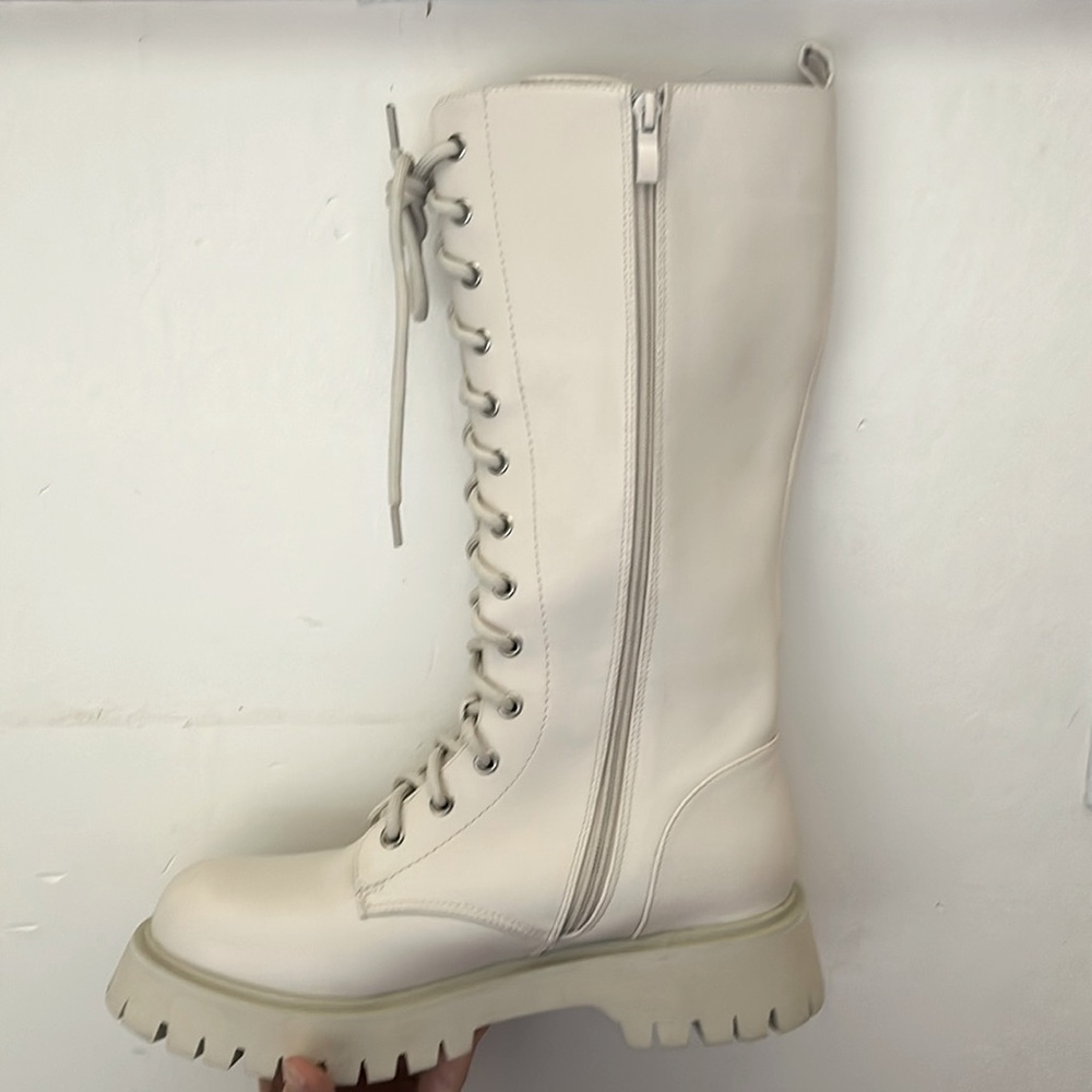 Creamy white koi footwear size eight boots. Never worn!